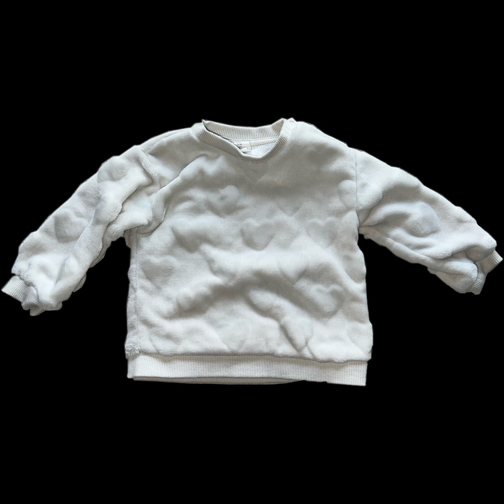 White baby sweater with hearts